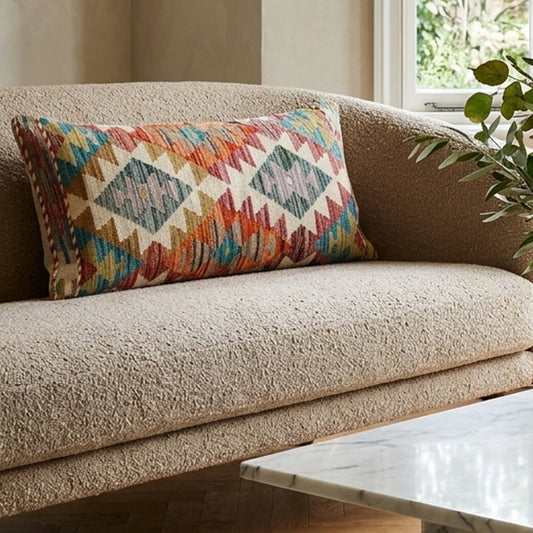 Kilim cushion cover with colorful geometric diamond pattern and woven edges