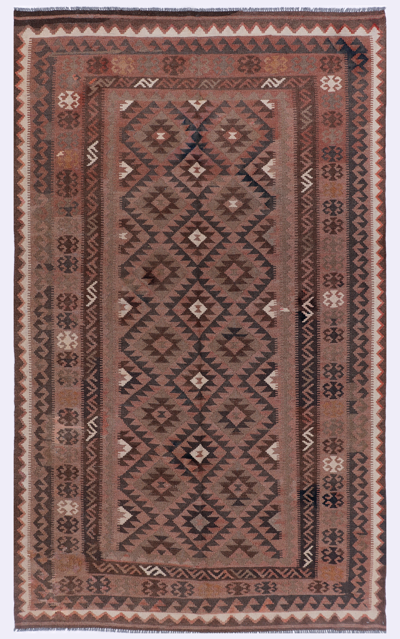 Rectangular brown kilim rug with central diamond medallion and patterned border
