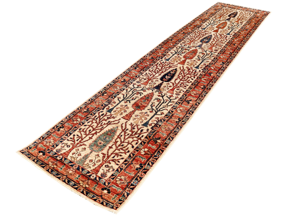 Long runner rug with red border, beige field, and repeating motifs in navy and teal