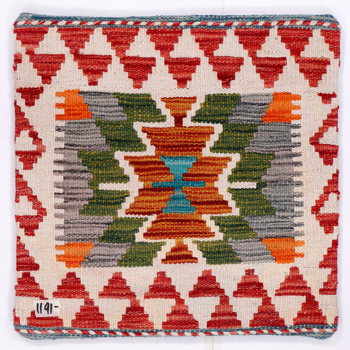 Kilim cushion cover with red border and central geometric medallion pattern