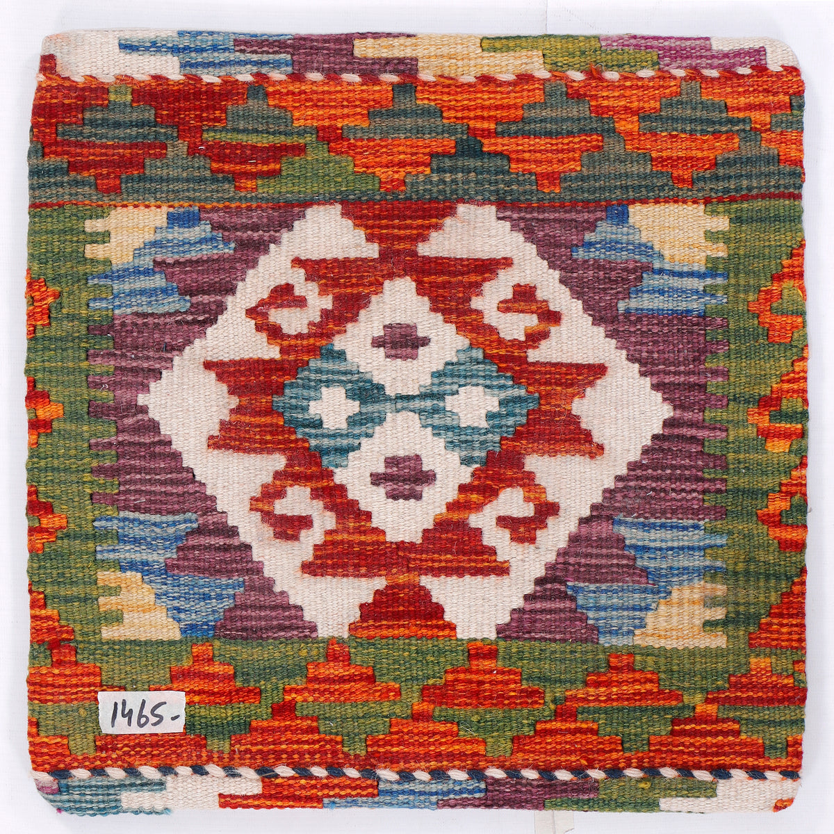 Square kilim cushion with geometric diamond motif in orange, green, blue