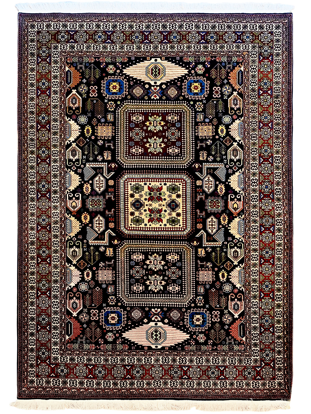 Azerbaijan rug, dark navy field with red border and geometric medallions, fringed edge