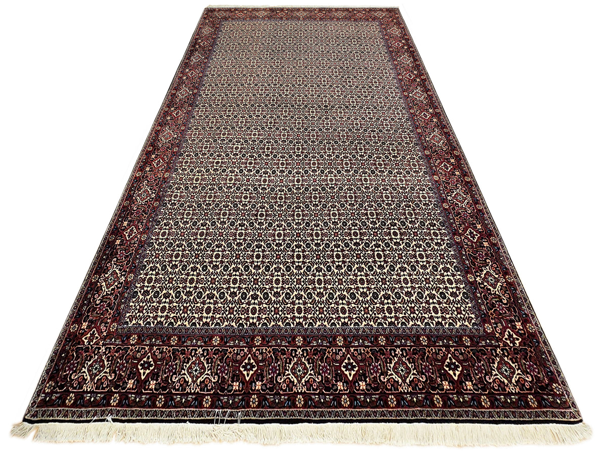 Bidjar rug runner-style view with beige center, dark red sides, and short fringe