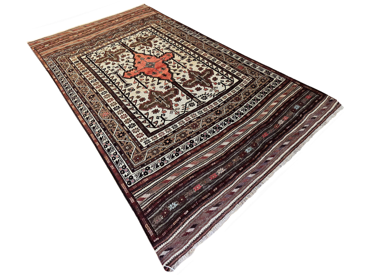 Soumak rug with central red diamond, cream and brown lattice pattern, and dark borders