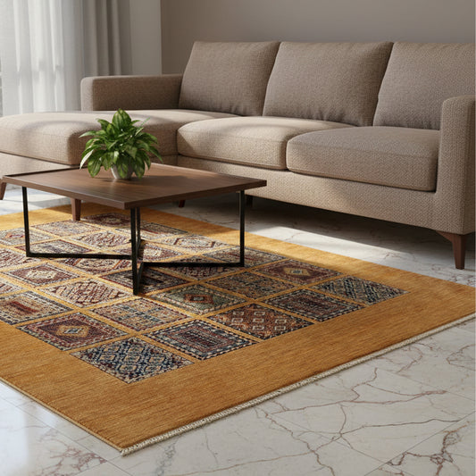 Geometric area rug with warm gold background and blue and red motifs under a living room sofa