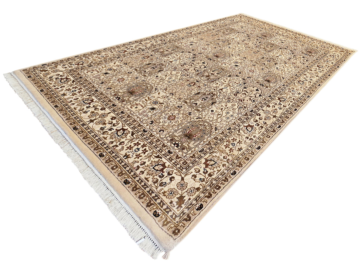 Bakhtiar rug with beige and brown diamond lattice pattern, corner fringe, and decorative border.