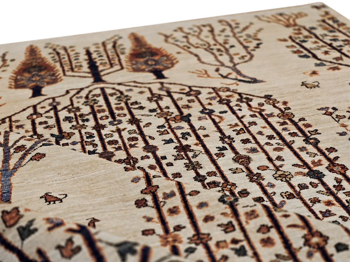 Close-up of cream rug weave with detailed vertical line and tree motifs in brown