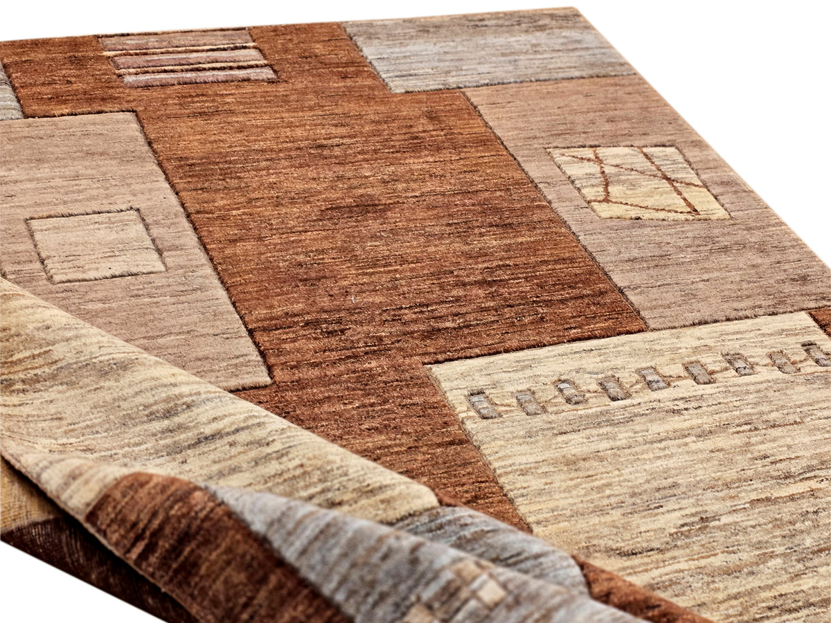 Patchwork area rug with brown and beige geometric blocks, flat woven texture