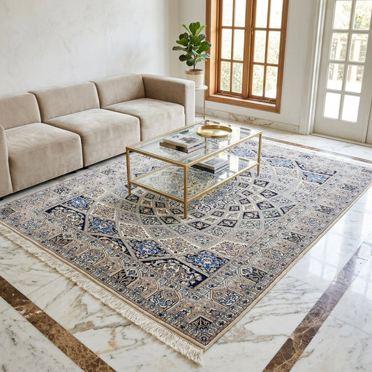 Beige, black, and blue patterned area rug with central medallion and fringed border.