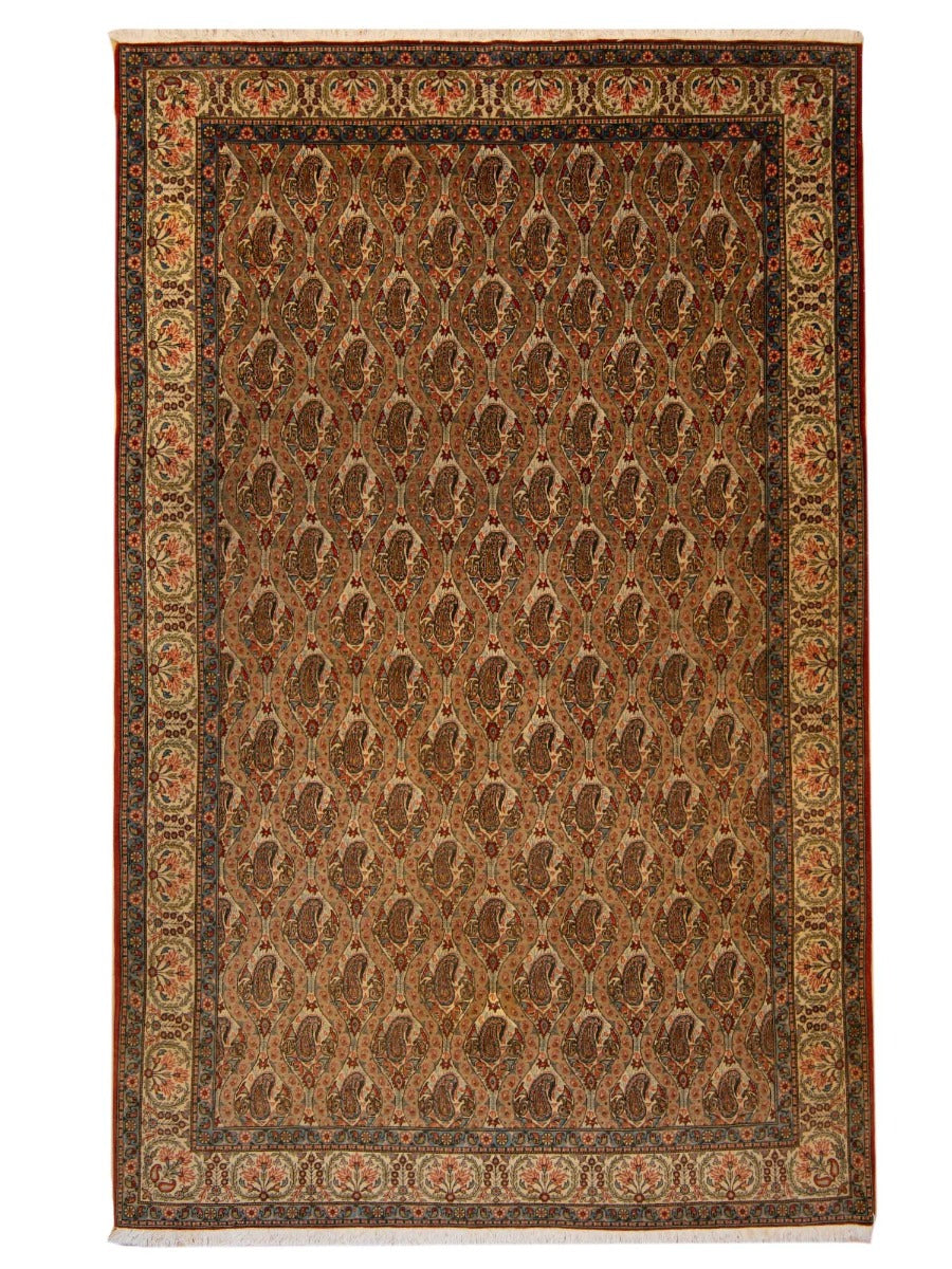 Ghom rug with ornate border and geometric medallion pattern, warm brown and cream.