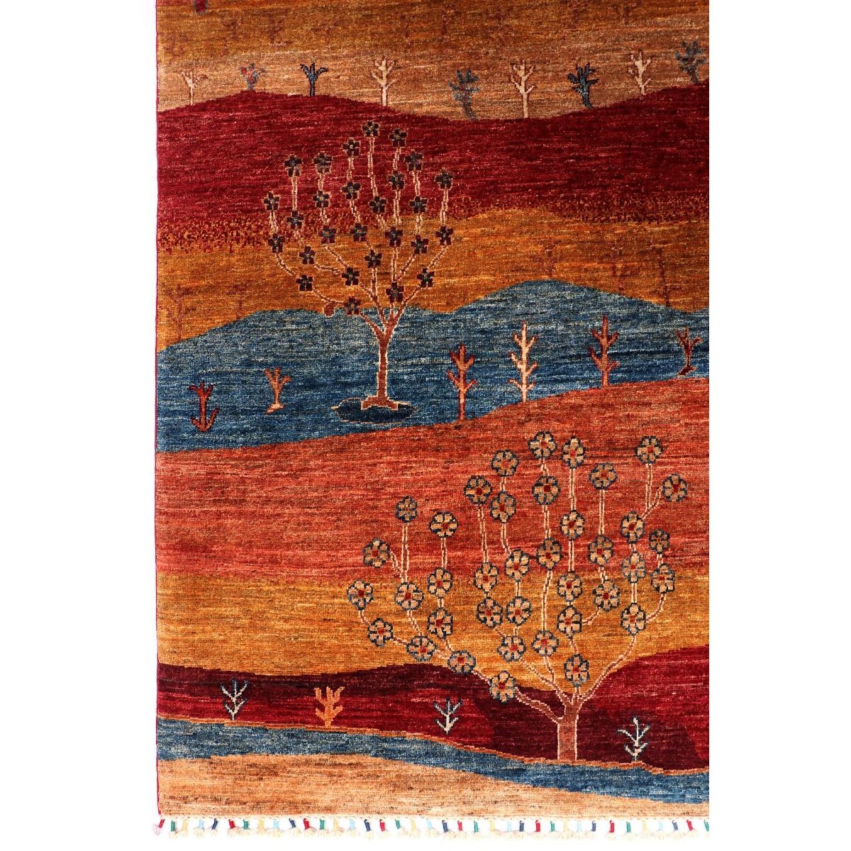 Multicolor rug with blue valley, red fields, and tree-and-flower medallion motif