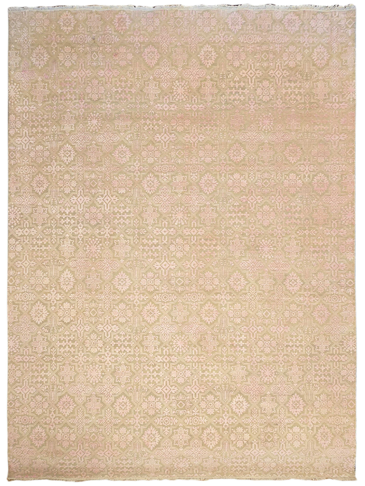 Beige area rug with soft pink and cream repeating geometric floral motifs, flat-woven