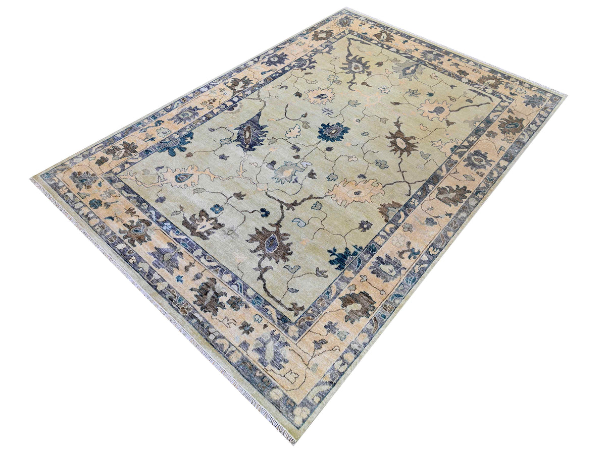 Oushak rug rectangular with pale beige field, blue floral corner accents, border trim