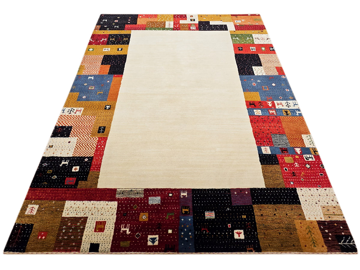 Rectangular patchwork area rug with cream center and multicolor border blocks