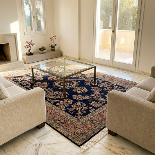 Navy Sarouk rug with ornate floral medallion, rust and beige accents, fringe corners