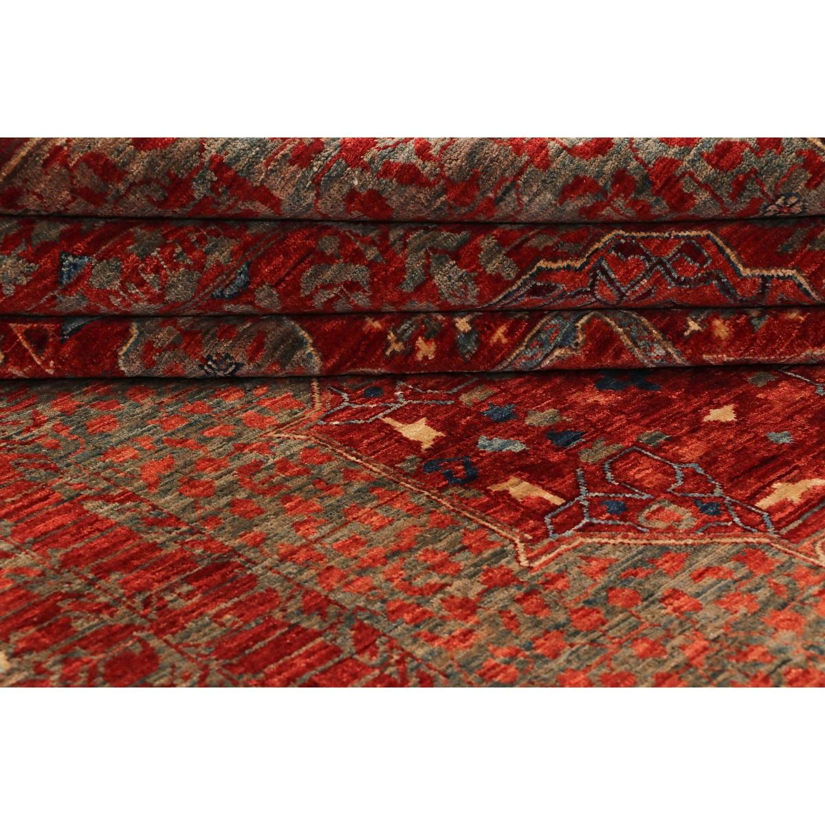 Mamluk rug close-up of multicolor geometric pattern on red pile