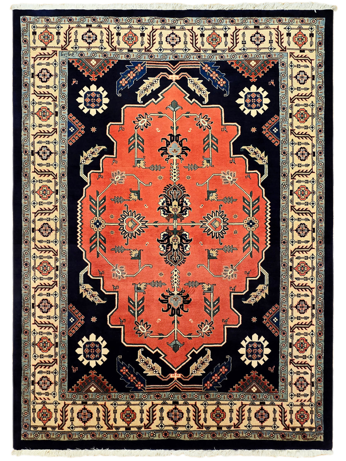 Fully framed rug with red central medallion on navy field and cream geometric border