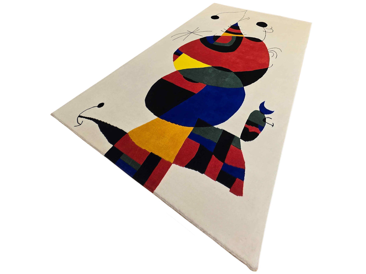 Abstract area rug with off-white base and colorful geometric cat design, rectangular