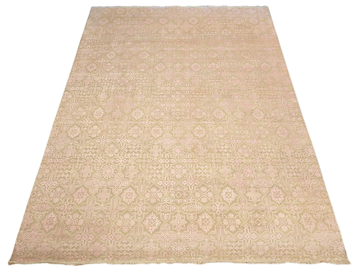 Beige area rug with light pink and cream geometric floral pattern, rectangular