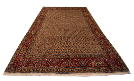 Moud rug with rust, dark blue and beige patterned field and decorative border