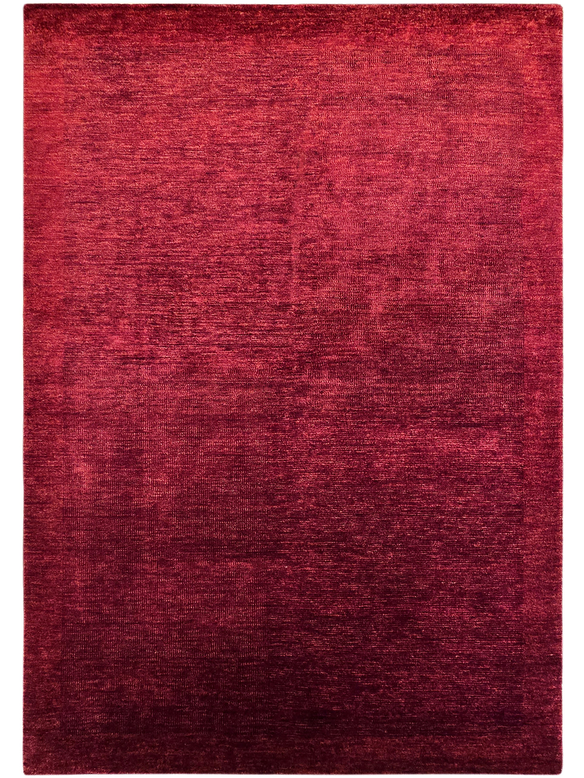 Red rectangular rug with abstract mottled pattern