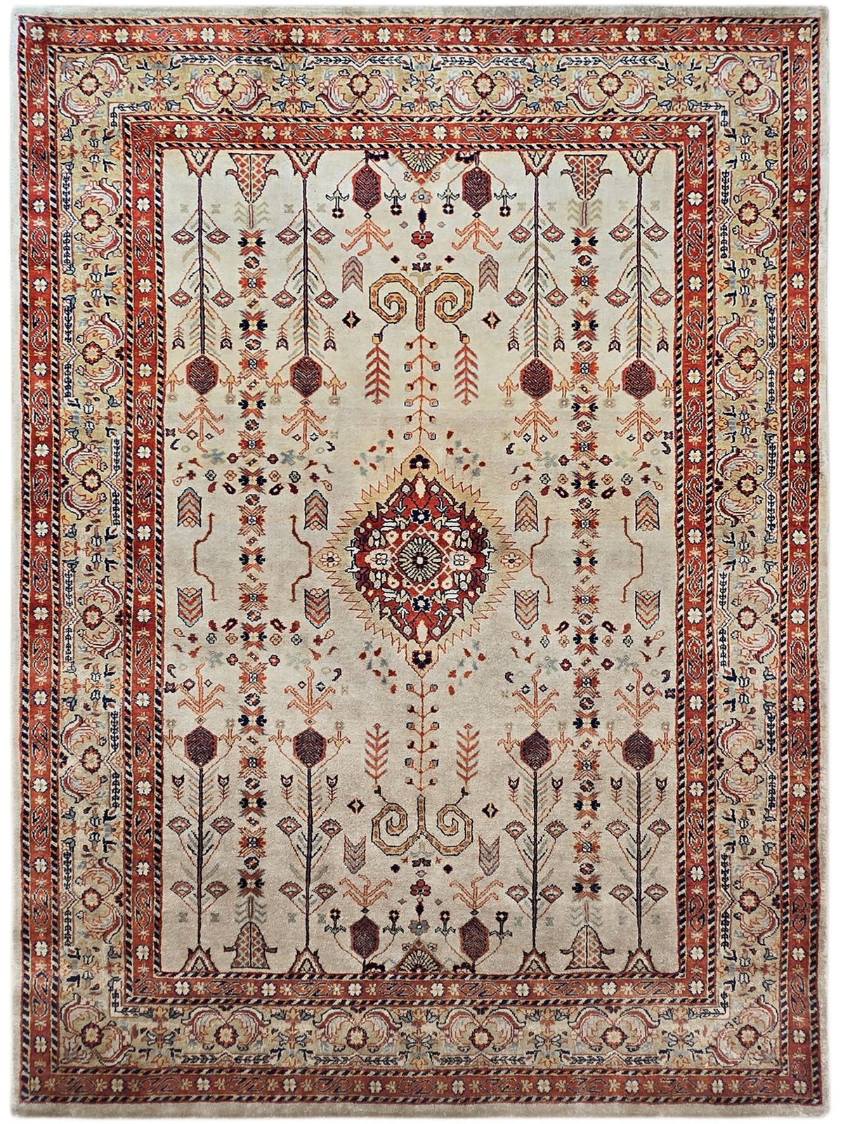 Full view rectangular rug with cream field, red medallion, and navy accents