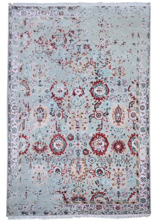 Oushak rug with light blue-gray distressed pattern, red circular medallions, and detailed border