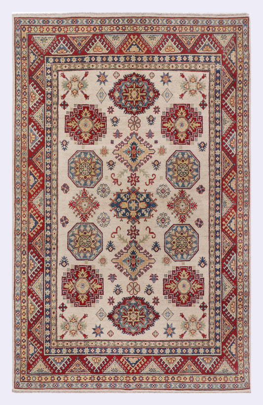 Red and cream geometric rug with central medallion and patterned border