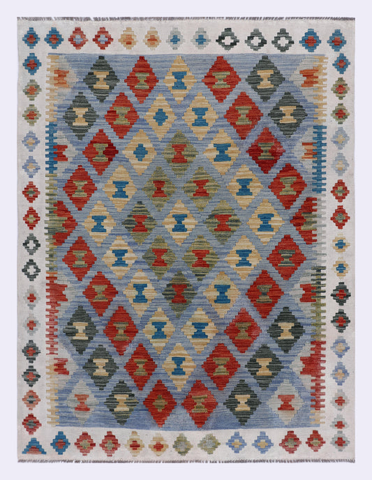 Kilim rug with blue geometric diamond pattern, red and black accents, cream border