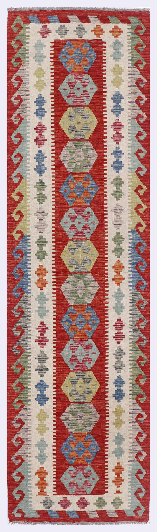 Caravan Spirit Kilim rug with vertical geometric panels in red, blue, and cream.