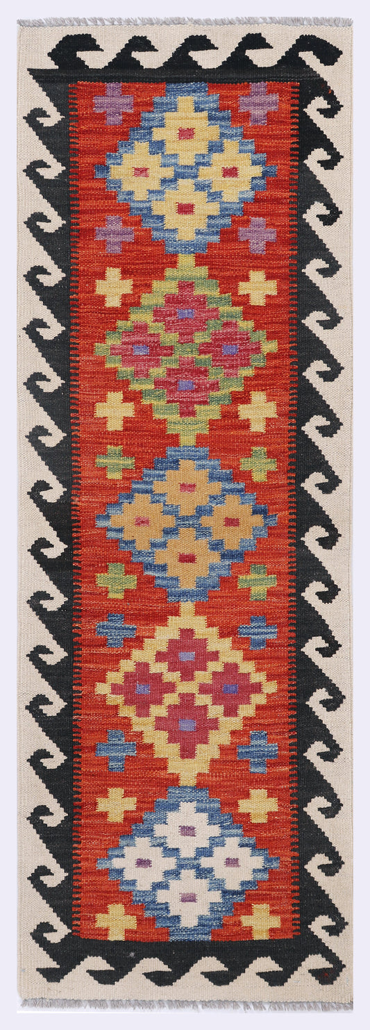 Red kilim rug with multicolor geometric hearts, crosses, and star motifs; 148x50 cm