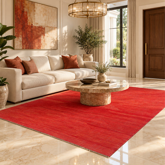 Red textured rug with flat weave and visible border edges