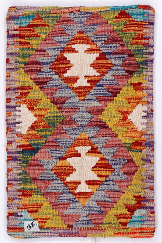 Kilim cushion cover front with multicolor geometric pattern and orange border accents