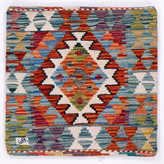 Square kilim cushion cover with multicolor geometric diamond pattern, visible stitched border
