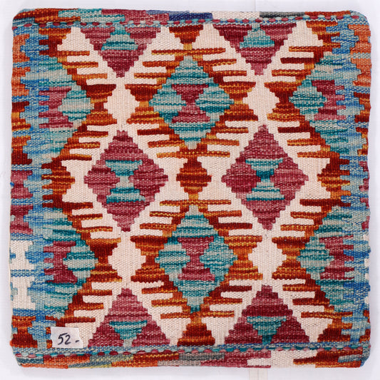 Diamond kilim cushion cover close-up, turquoise and red geometric lattice pattern