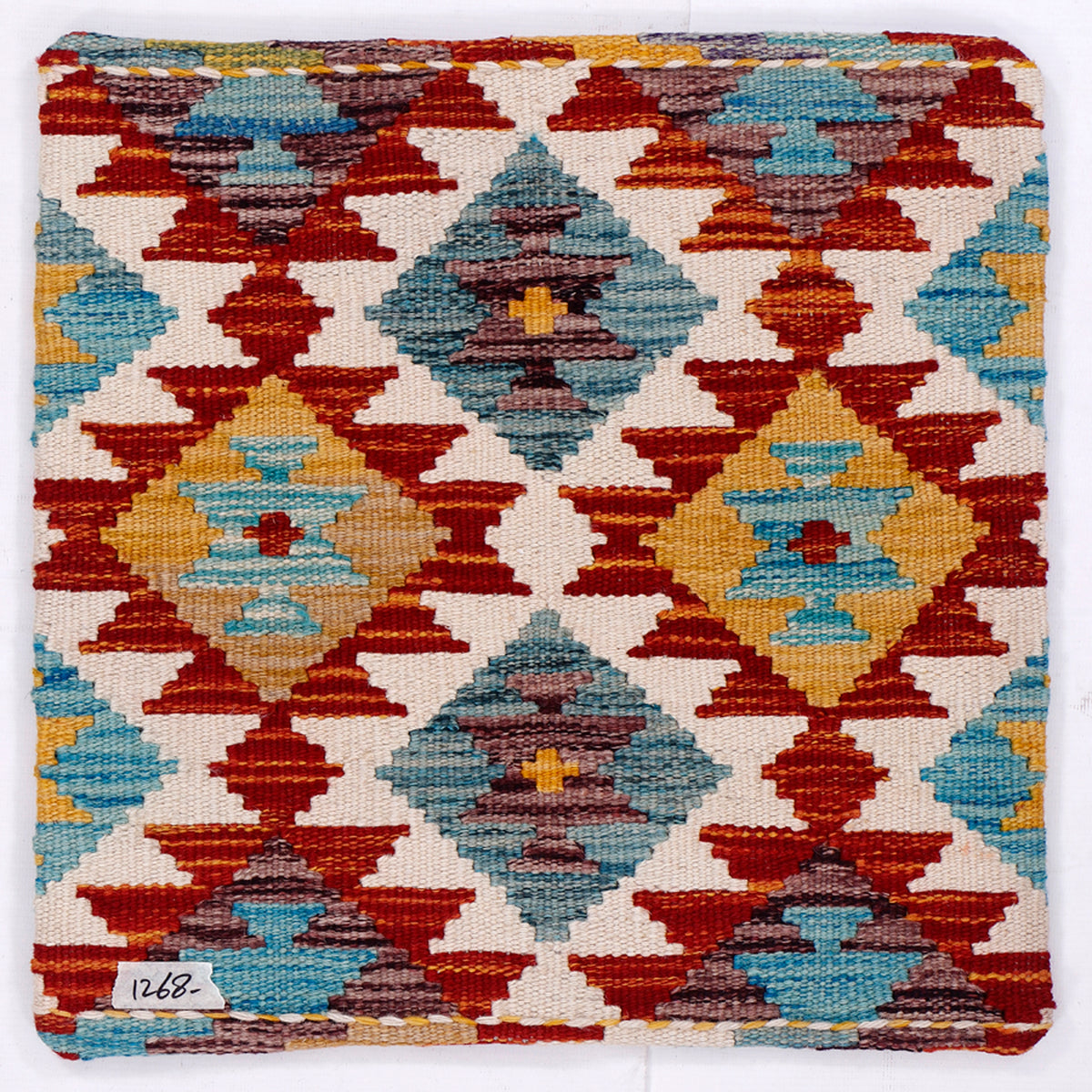 Kilim cushion 45x45 cm close-up with red, blue, and cream diamond blocks