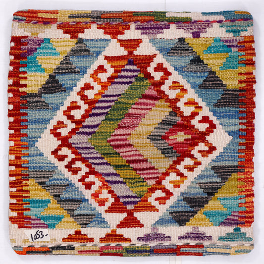 Multicolor kilim cushion front with blue, red, and white geometric diamond pattern