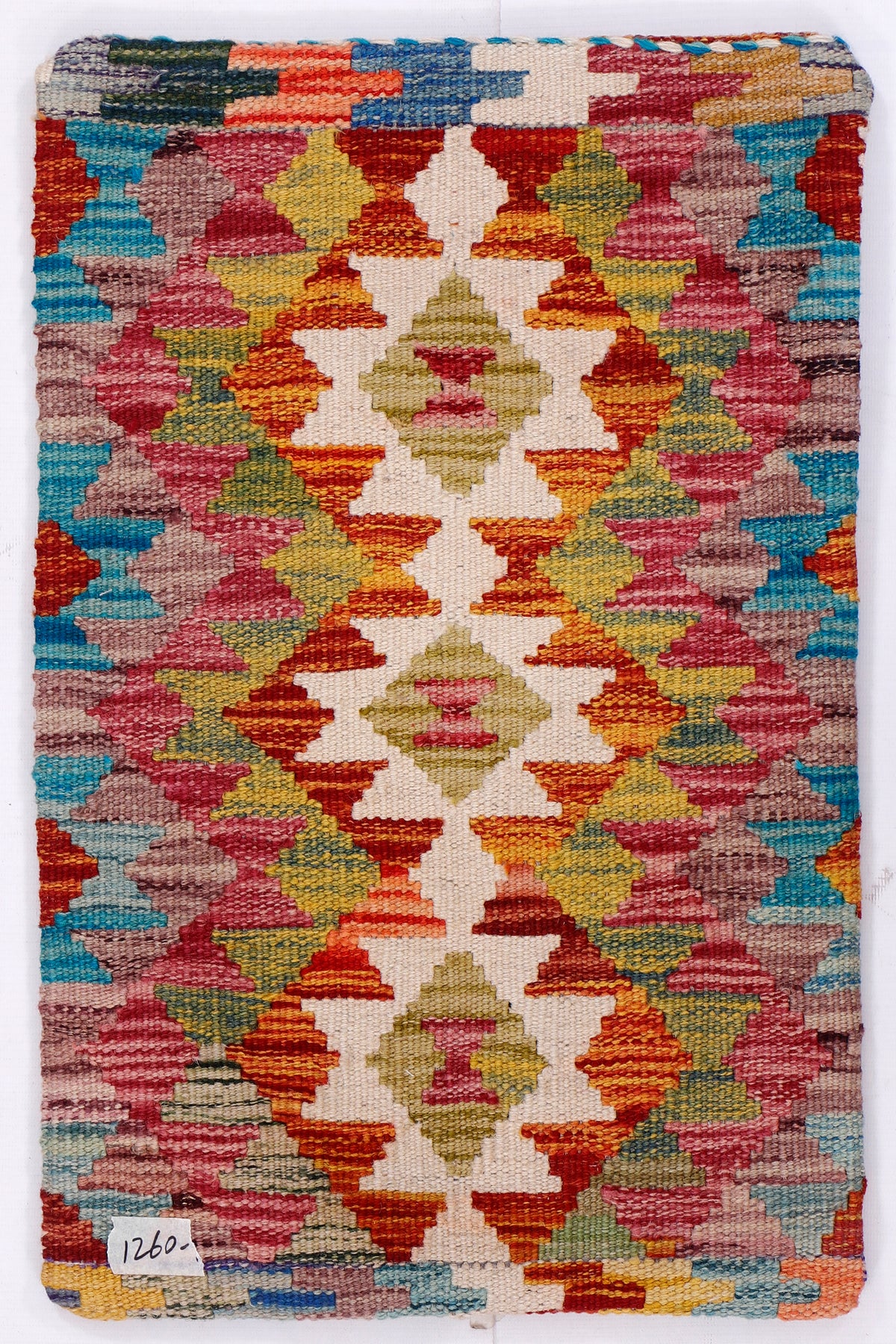 Kilim cushion cover close-up of multicolor geometric weave pattern