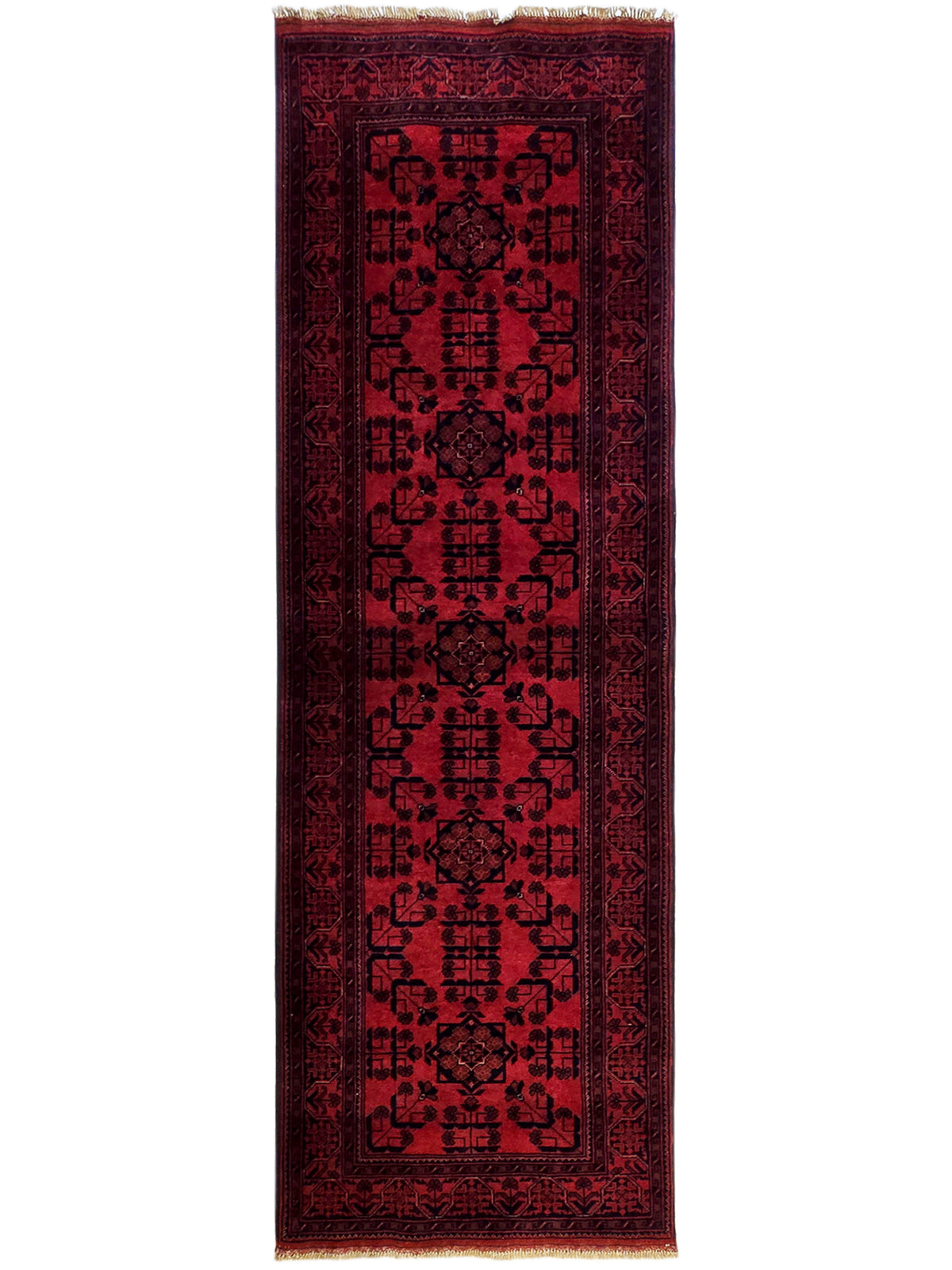 Khanmohamad rug with deep red field, dark geometric motifs, and fringed edges.