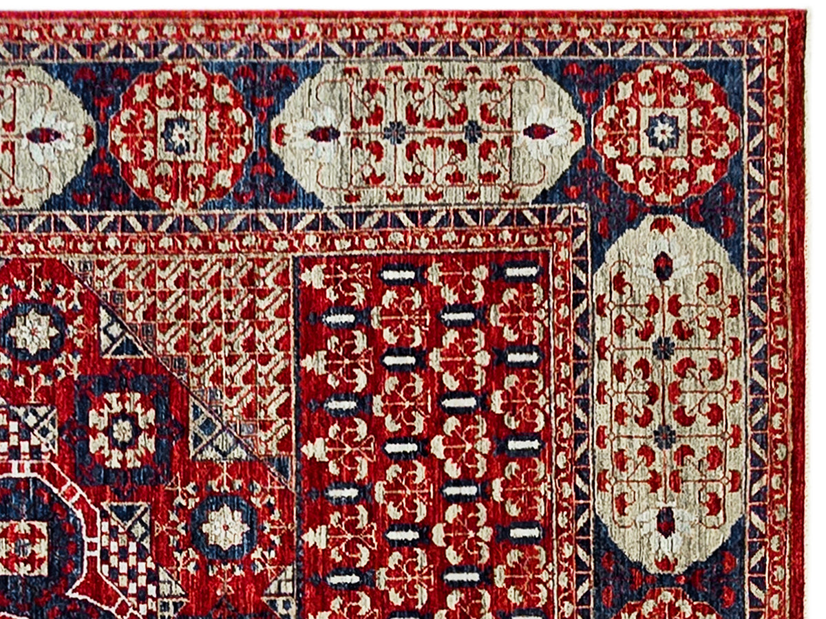 Mamluk rug close-up with red ground, blue bands, and cream elephant-like medallion shapes
