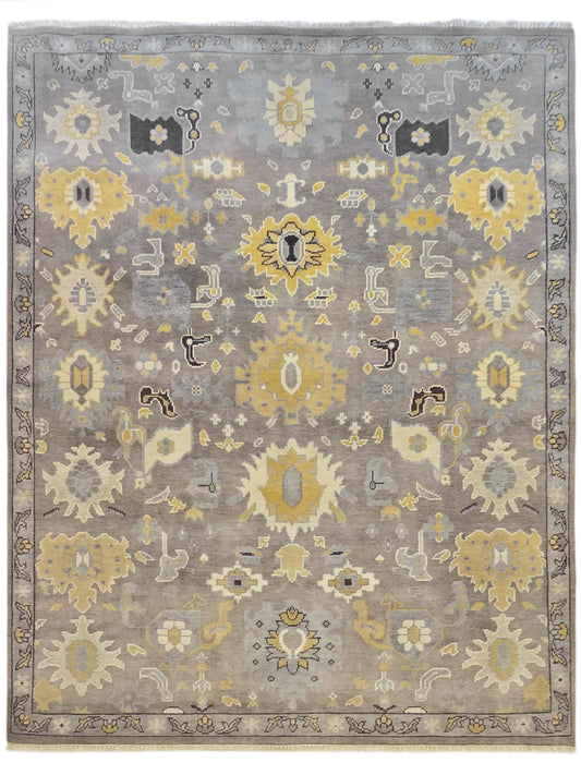 Oushak rug front view with gray background, yellow floral medallions, and border.
