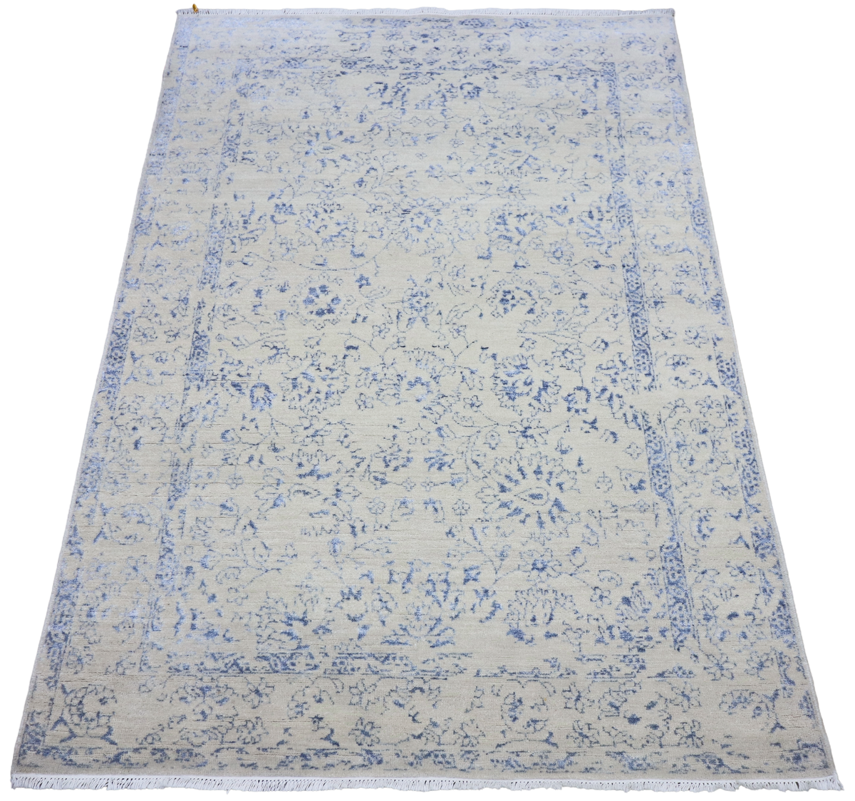 Ice blue area rug with distressed floral pattern, fringed border, 240x168 cm