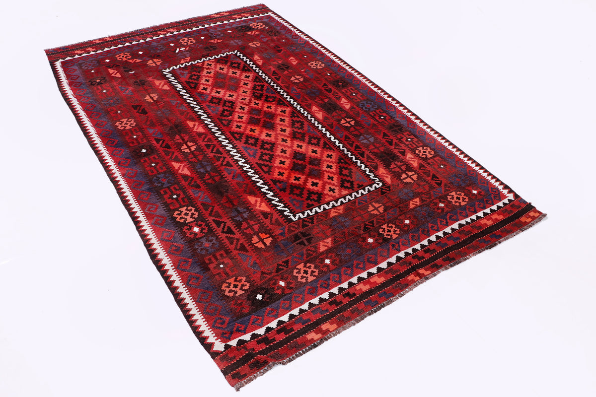 Red kilim rug with central diamond medallion and bold geometric border