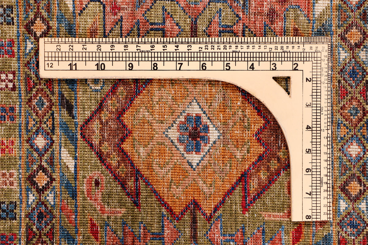 Geometric rug pattern with central diamond medallion and visible measuring tape