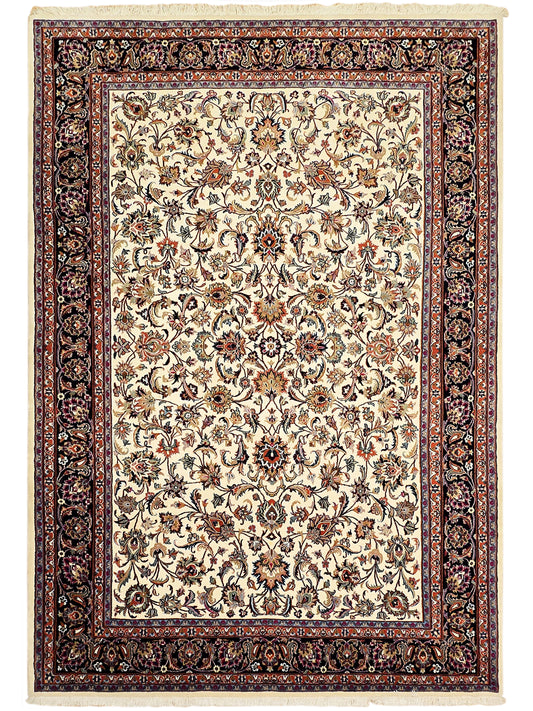 Cream floral ornamental rug with dark border and fringed edges