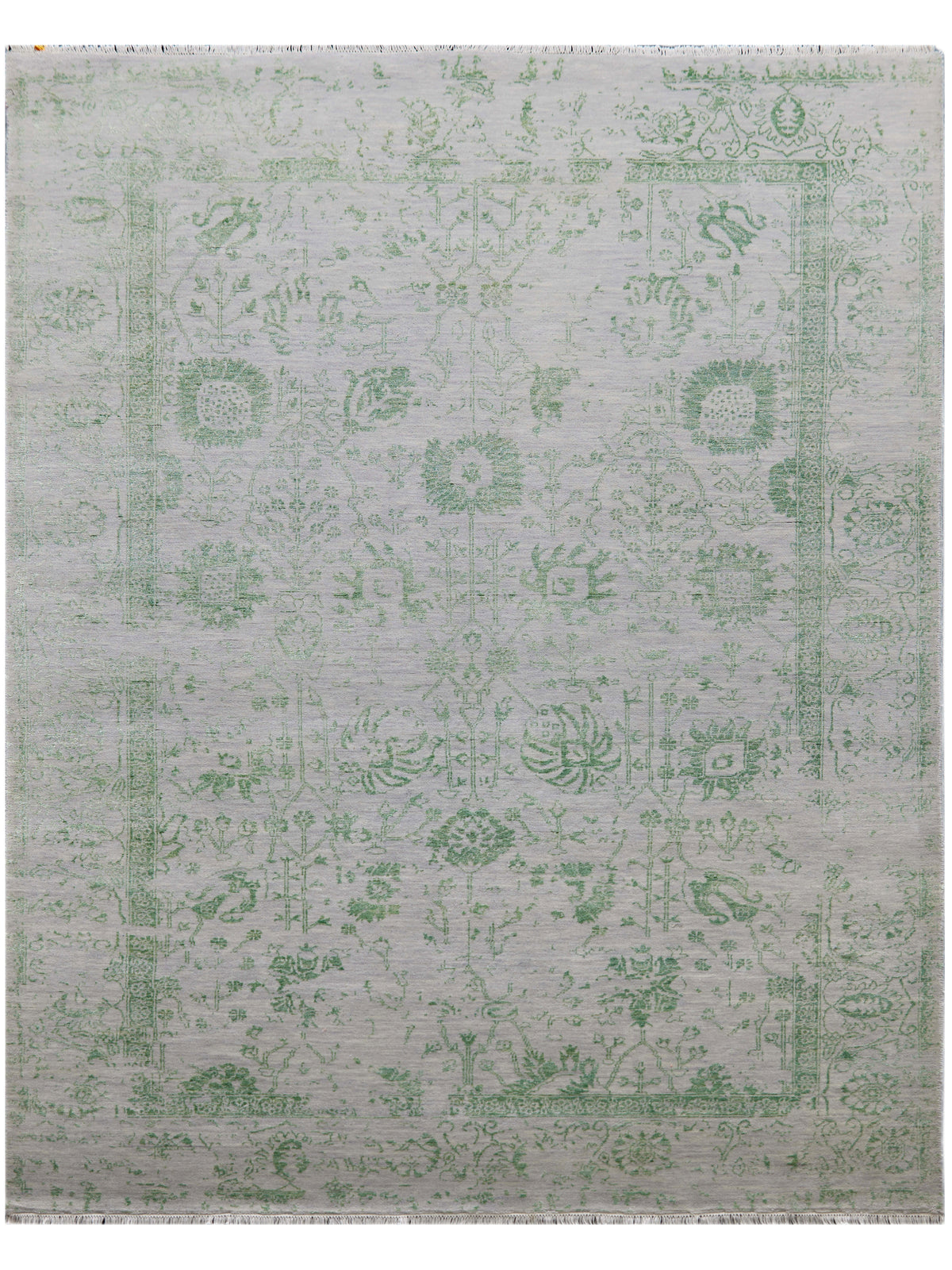 Light gray rug with green vintage-style pattern and flat, textured surface