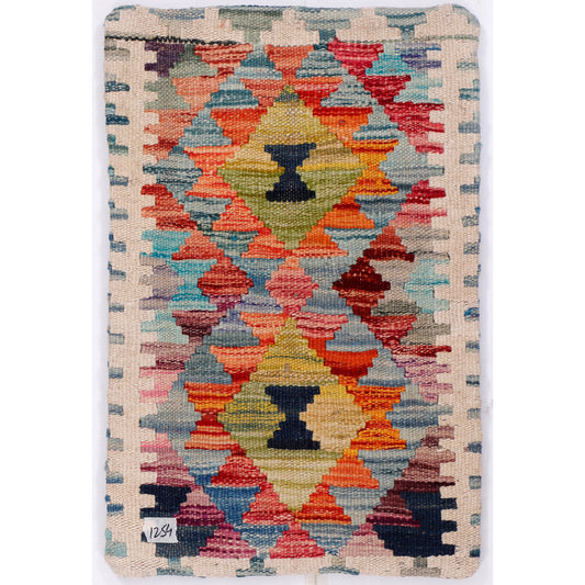 Blue kilim cushion cover with a woven geometric pattern in red, orange, blue, and yellow