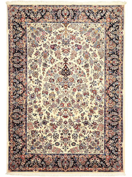 Floral Persian-style area rug with cream center, dark navy border, and fringed edges