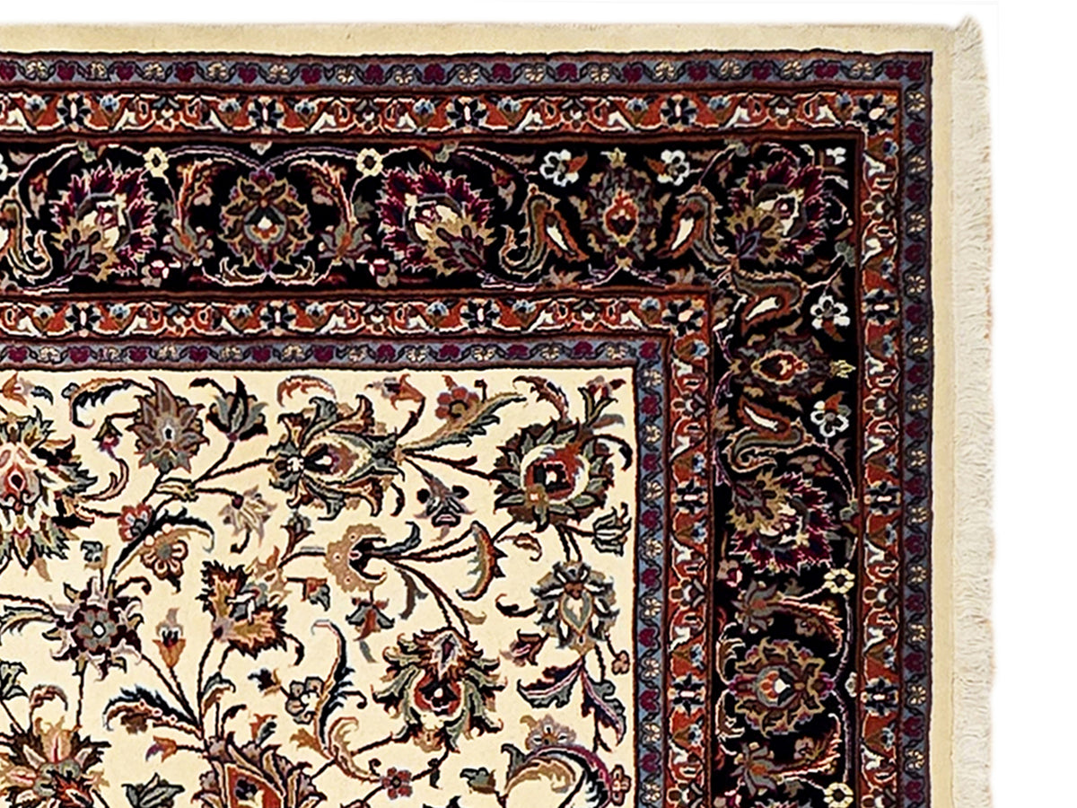 Close-up of cream floral rug panel with dark ornamental side border