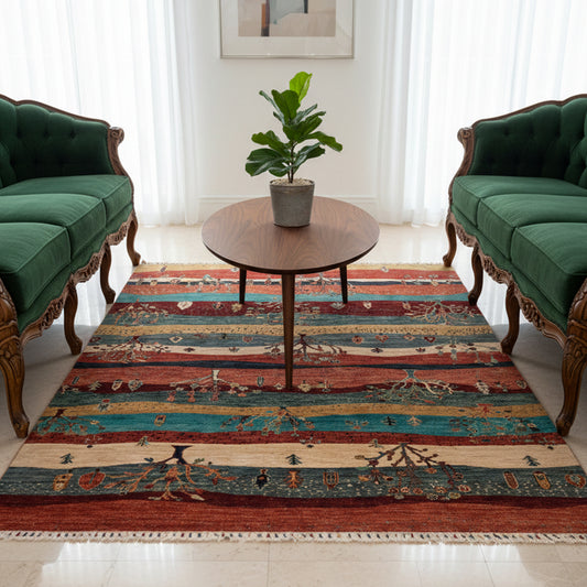 Ariana Gabbeh rug with multicolor horizontal bands, tree motifs, and fringed edges.